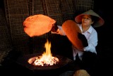 Woman Baking Rice Crackers